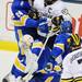 Michigan senior Luke Glendening gets caught up with Lake Superior State freshman Kevin Czuczman behind the goalie in the first period at Yost Arena on Friday night. Melanie Maxwell I AnnArbor.com